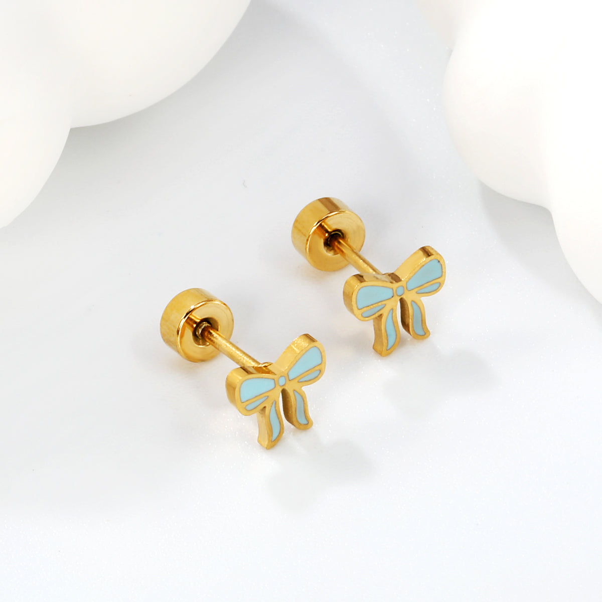 Baby blue and gold bow Screwback studs On white Back, showing flat screw-back detail
