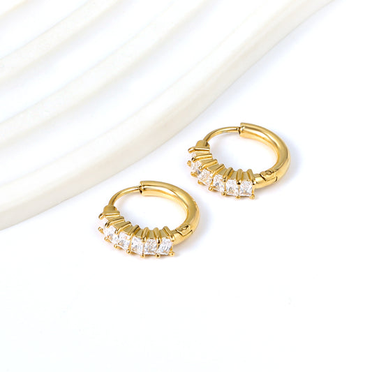 Baguette Huggie Hoops shown on a white background