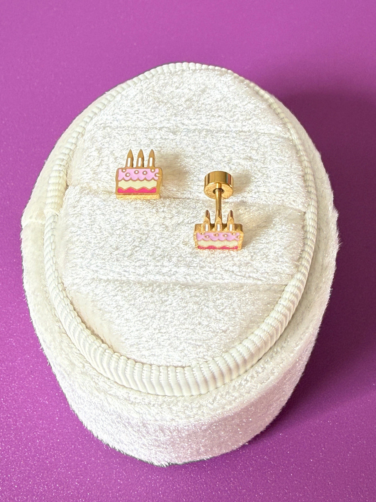Birthday cake Screwback studs shown on a white velvet jewelry box, showing enamel color and Screwback details
