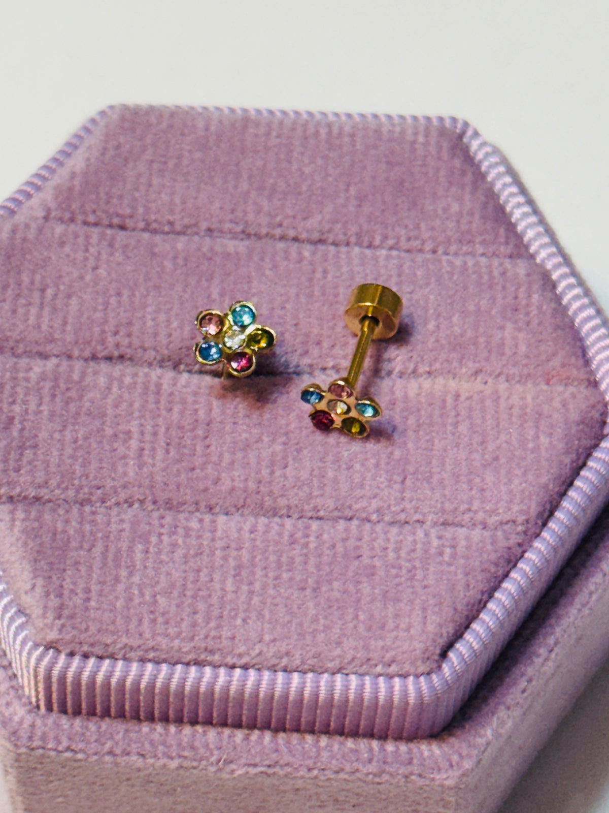 Colorful Flower Crystals Studs Shown on a velvet jewelry box to show sparkle and screw back detail