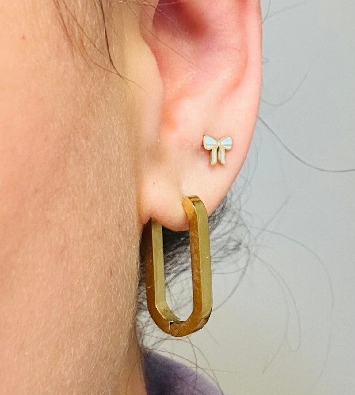 Baby blue bow studs