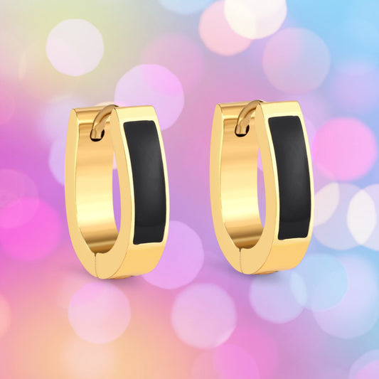 A pair of black and gold enamel strip hoop earrings on a colorful bokeh background.
