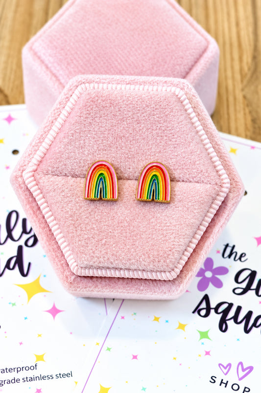 Rainbow Screwback studs shown on a light pink velvet box