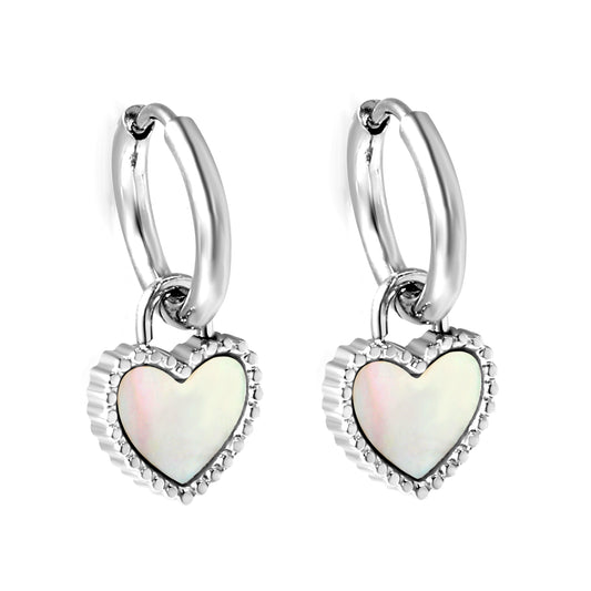 Silver hoop earrings with heart-shaped charms on a white background